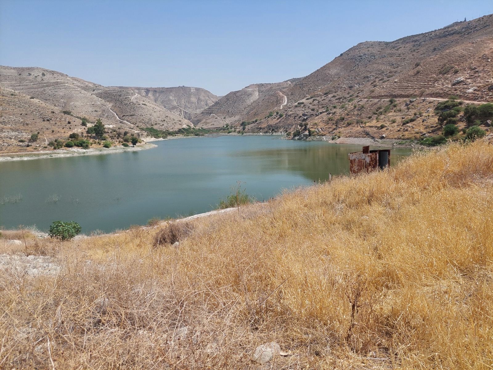 Dam reservoir between dry hills, northern Jordan Valley